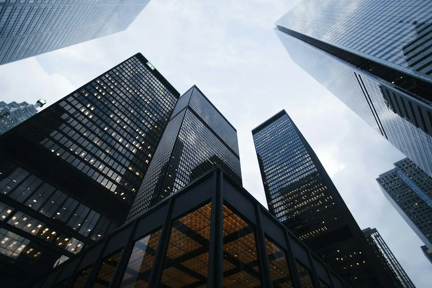 Tall glass office buildings seen from street level